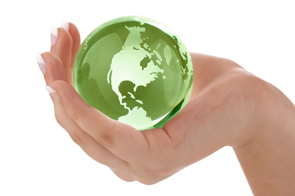 Green globe in female hand — Stock Photo, Image