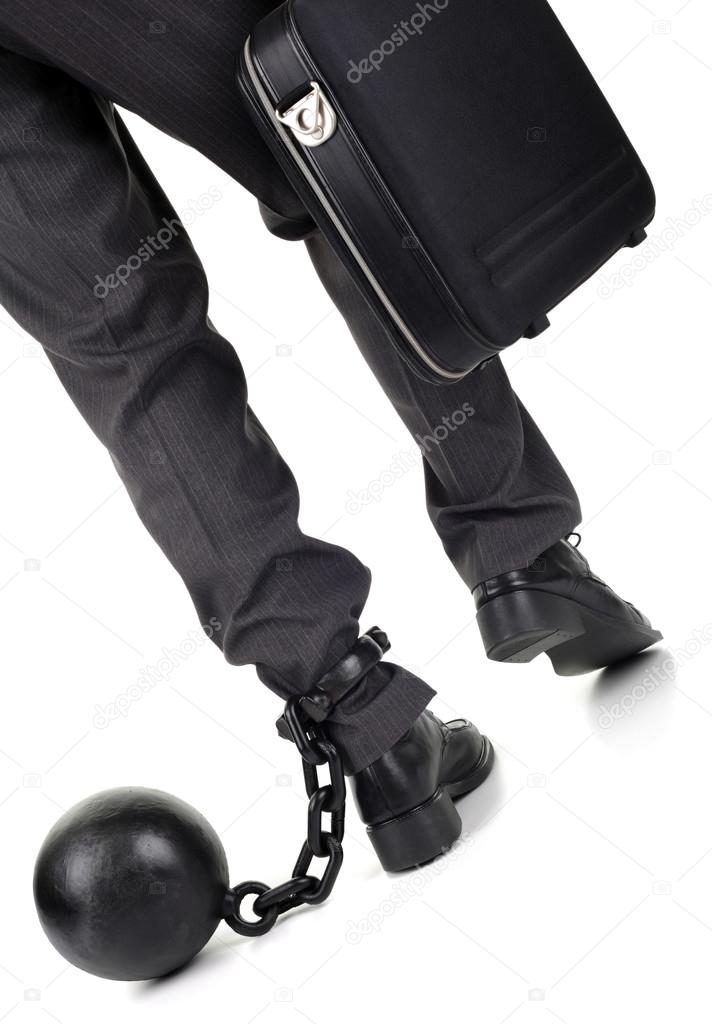 Ball and chain on businessman