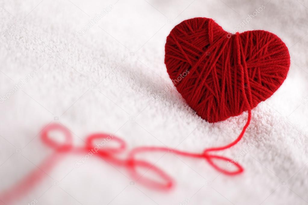 Yarn of wool in heart shape symbol