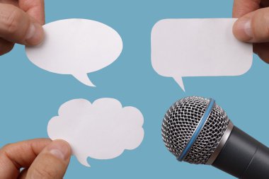 Blank speech bubbles with microphone clipart
