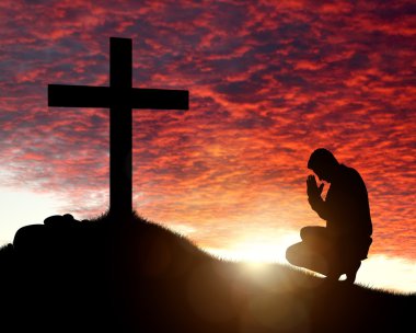 Man praying to a cross clipart