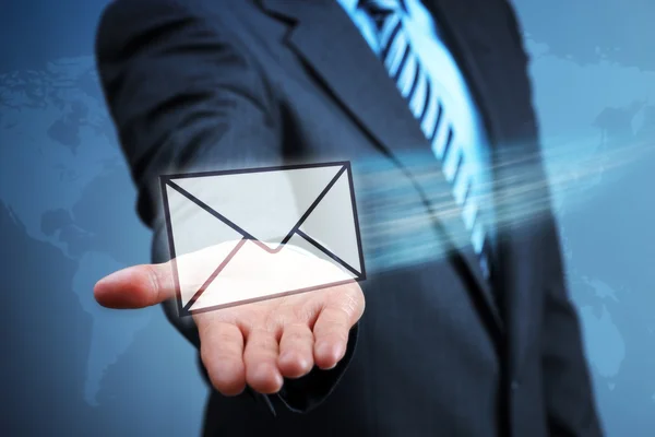 Businessman holding a virtual envelope — Stock Photo, Image