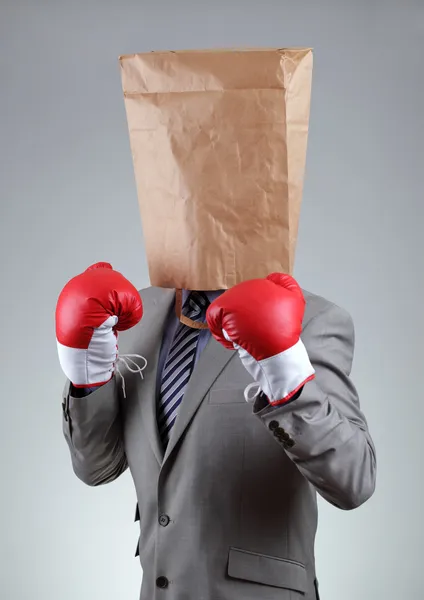 Homme d'affaires avec un sac en papier sur la tête — Photo