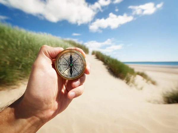 Hand holding a compass — Stock Photo, Image