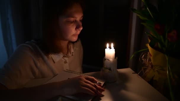 Girl Looking Burning Candles Blowing Out Candles Room Writing Makes — Video