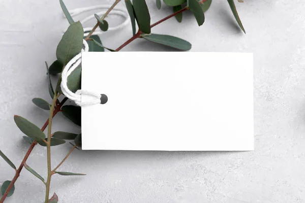 Rectangle White Gift Tag Mockup Eucalyptus Leaves Grey Background Label — стоковое фото