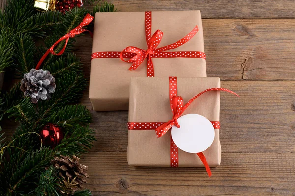 Christmas Kraft Gifts Box Red Ribbon Rustic Wooden Background Christmas — ストック写真