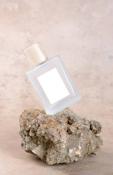 Transparent Bottle Perfume White Labels Stone Podium Beige Terracotta Background — Stockfoto