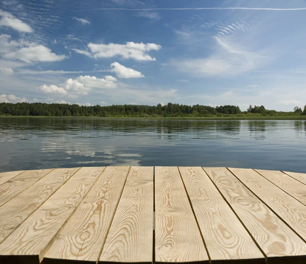 Tabletop with lake view — Stock Photo, Image