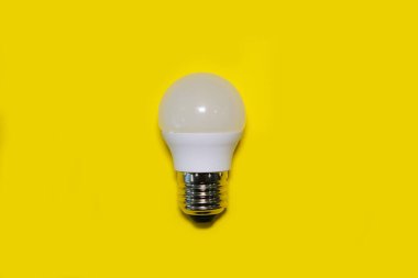 LED lamp on a bright yellow background. High quality photo.