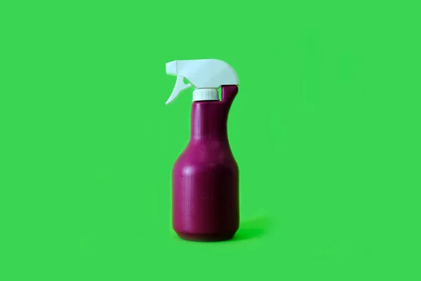 Cleaner product, spray on a bright green background — Stock Photo, Image