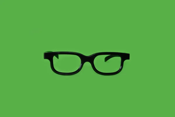 Glasses on a bright green background — Stock Photo, Image