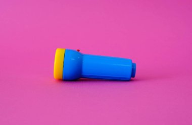 Flashlight on a bright pink background. High quality photo