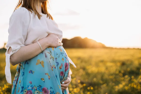 Horizontal Close Photo Pregnant Woman Holding Abdomen Both Hands Bright — Stockfoto