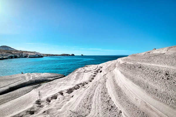 Beautiful landscape of white rocks of Sarakiniko beach, Aegean sea, Milos island , Greece. Empty cliffs, summer day sunshine, clear sea, blue waters, azure lagoon, no people, beautiful landscape