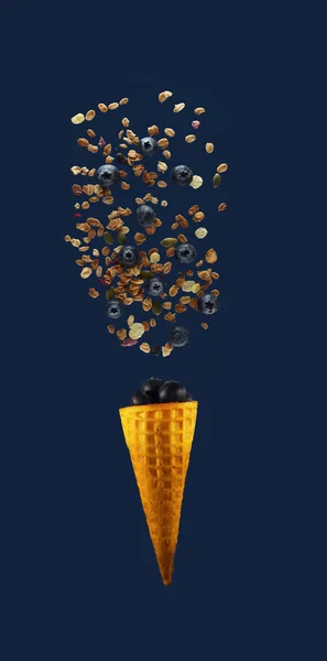 Healthy Food Concept Granola Blueberry Pouring Waffle Cone Blue Background — Stock Photo, Image