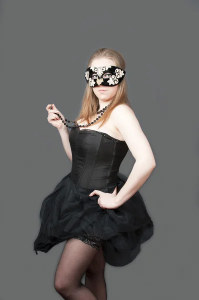 Girl standing in the mask — Stock Photo, Image