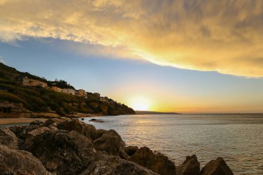 Cozy seaside view at the dusk, sunset by the sea