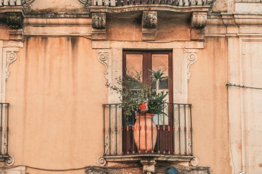CATANIA, Italy - November 2021: Old traditional architecture details in Catania, street of Catania downtown, Sichily, Italy