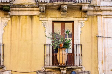 CATANIA, Italy - November 2021: Old traditional architecture details in Catania, street of Catania downtown, Sichily, Italy