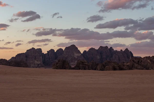 Sunset in Wadi Rum desert. Orange sunset sky and clouds in Wadi Rum, Jordan