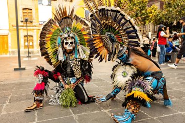 Aztec shamans in Front Of Cathedral in Zocalo, two man with feathered headdress, Mexico