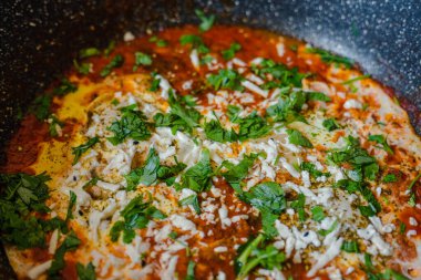 Israeli dish from eggs with tomato sauce - Sakshuka