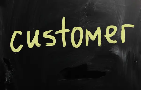 "customer" handwritten with white chalk on a blackboard — Stock Photo, Image