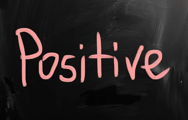 "positive" handwritten with white chalk on a blackboard — Stock Photo, Image