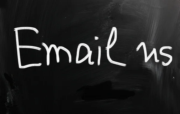 "E-mail us "handwritten with white chalk on a blackboard — стоковое фото