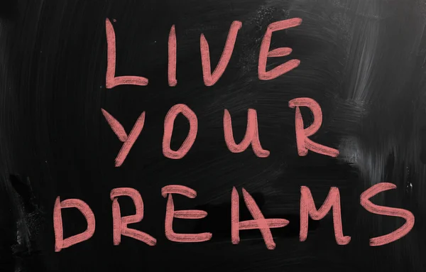 "Make your dreams come true" handwritten with white chalk on a b — Stock Photo, Image