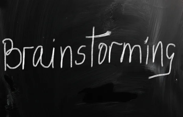 "Brainstorming " handwritten with white chalk on a blackboard — Stock Photo, Image
