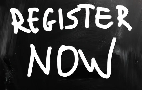 "Register now" handwritten with white chalk on a blackboard — Stock Photo, Image