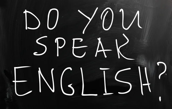 "Parlez-vous anglais "écrit à la main à la craie blanche sur un blackbo — Photo