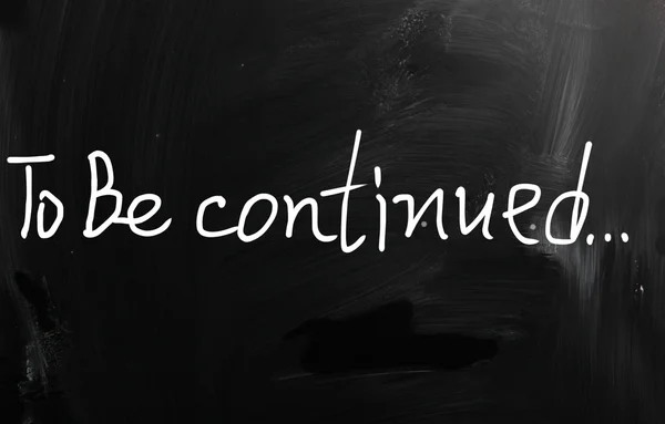 "To be continued" handwritten with white chalk on a blackboard — Stock Photo, Image