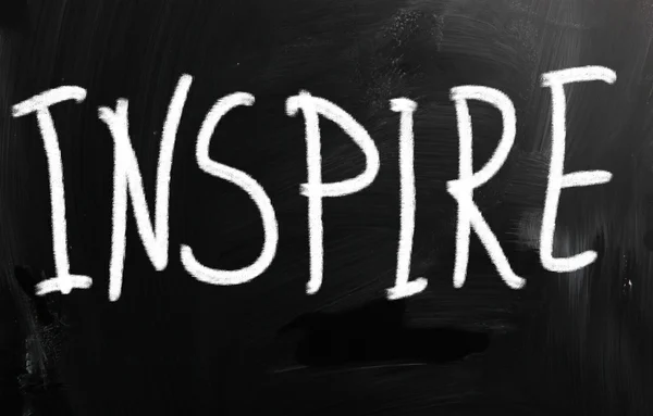 "Inspire" handwritten with white chalk on a blackboard — Stock Photo, Image