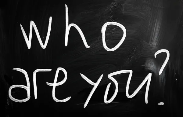 "Who are you" handwritten with white chalk on a blackboard — Stock Photo, Image