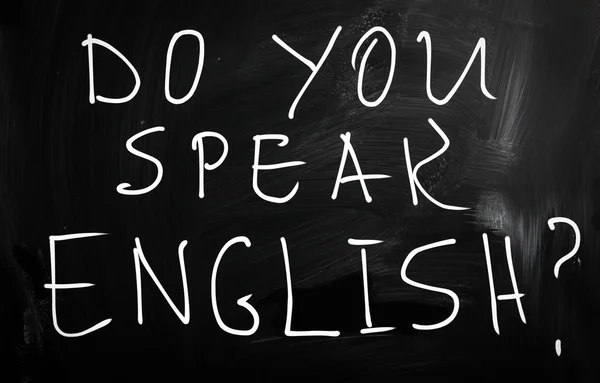 "Do you speak english "handwritten with white chalk on a blackbo — стоковое фото