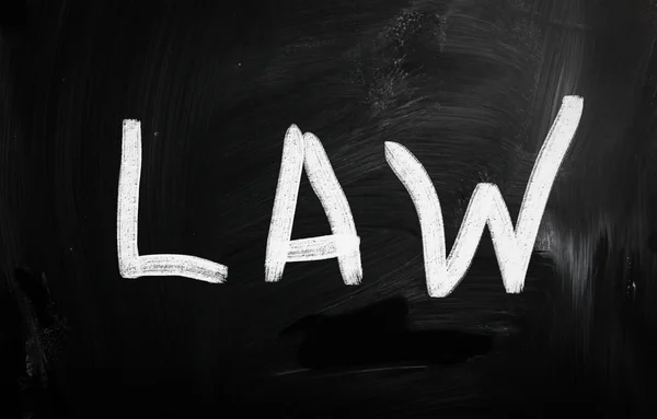 The word "Law" handwritten with white chalk on a blackboard — Stock Photo, Image