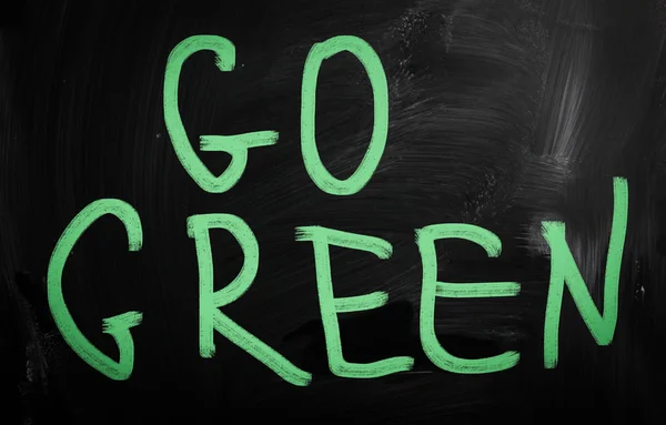 "Go green" handwritten with white chalk on a blackboard — Stock Photo, Image
