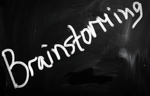 "Brainstorming " handwritten with white chalk on a blackboard — Stock Photo, Image