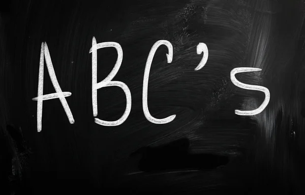 "ABC's" handwritten with white chalk on a blackboard — Stock Photo, Image