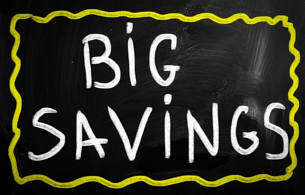 "Big savings" handwritten with white chalk on a blackboard — Stock Photo, Image