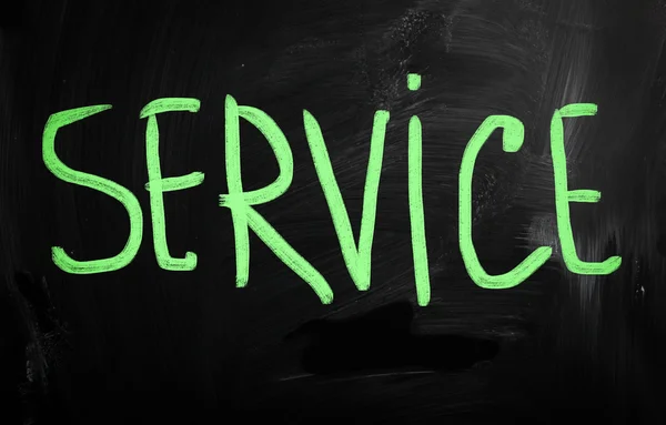 "service" handwritten with white chalk on a blackboard — Stock Photo, Image