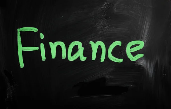 "Finanzas "escrito a mano con tiza blanca en una pizarra —  Fotos de Stock