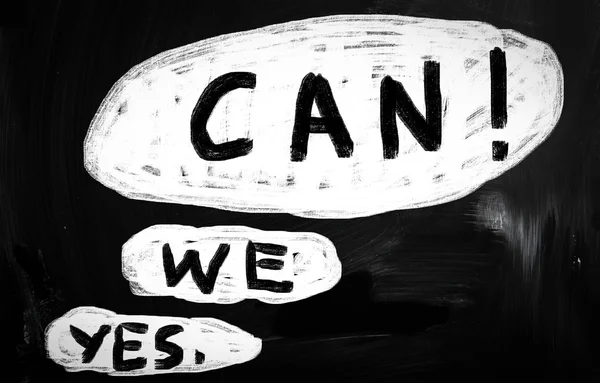 "Yes, we can!" handwritten with white chalk on a blackboard — Stock Photo, Image