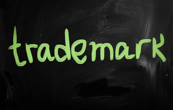 Trademark" handwritten with white chalk on a blackboard — Stock Photo, Image