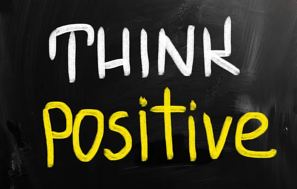 "Think positive" handwritten with chalk on a blackboard — Stock Photo, Image