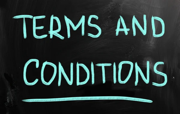 "Terms & Conditions "handwritten with chalk on a blackboard — стоковое фото