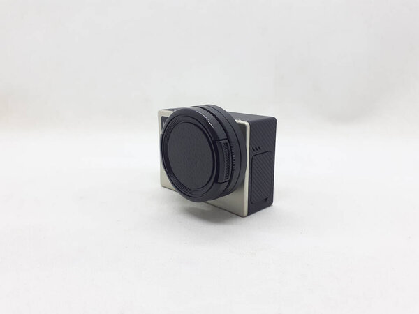 A small black and grey action camera with its accessories on white isolation backgroundn